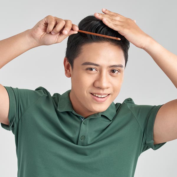 asian man combing hair